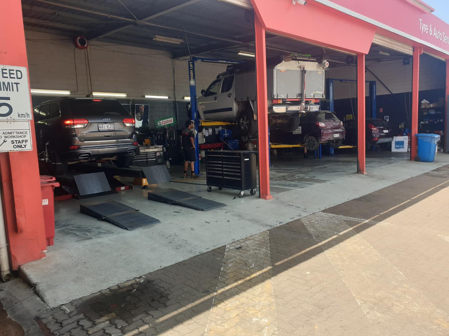 Castle Mechanical workshop bays in Garbutt, Townsville, with cars on hoists